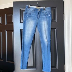 Democracy blue jeans with distressing.